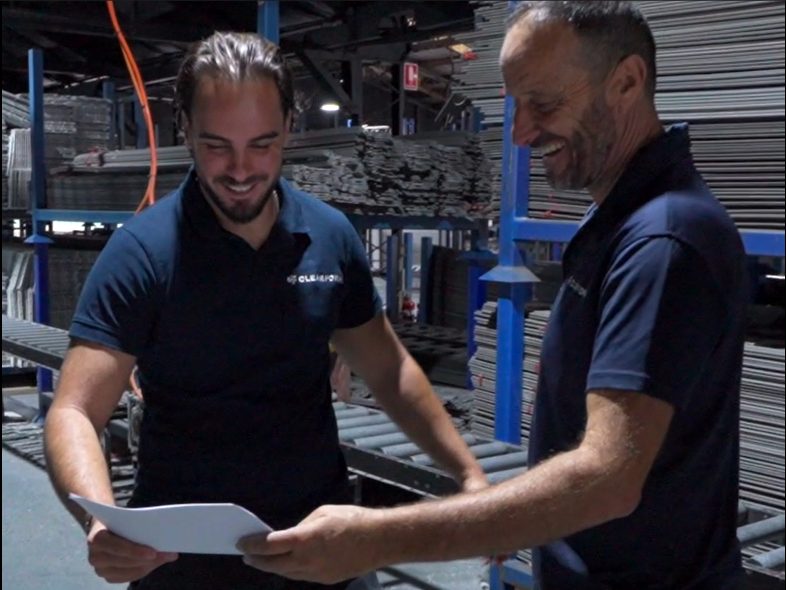 Certification body auditor reviewing the system with the client during the Stage 2 audit