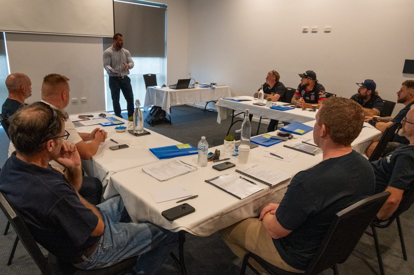 Management review meeting with the client leadership team in a boardroom
